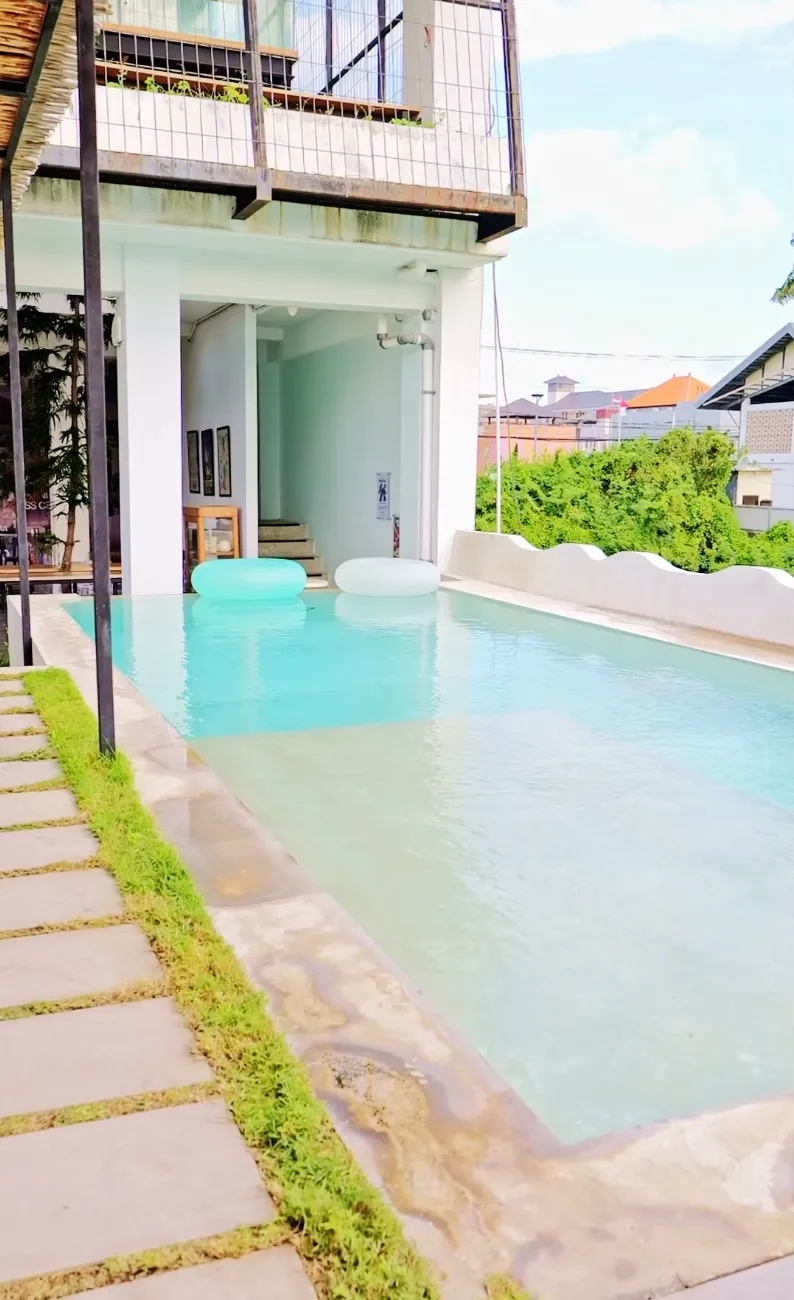 Video thumbnail of the serene swimming pool at the at06 lifestyle hub during the day.