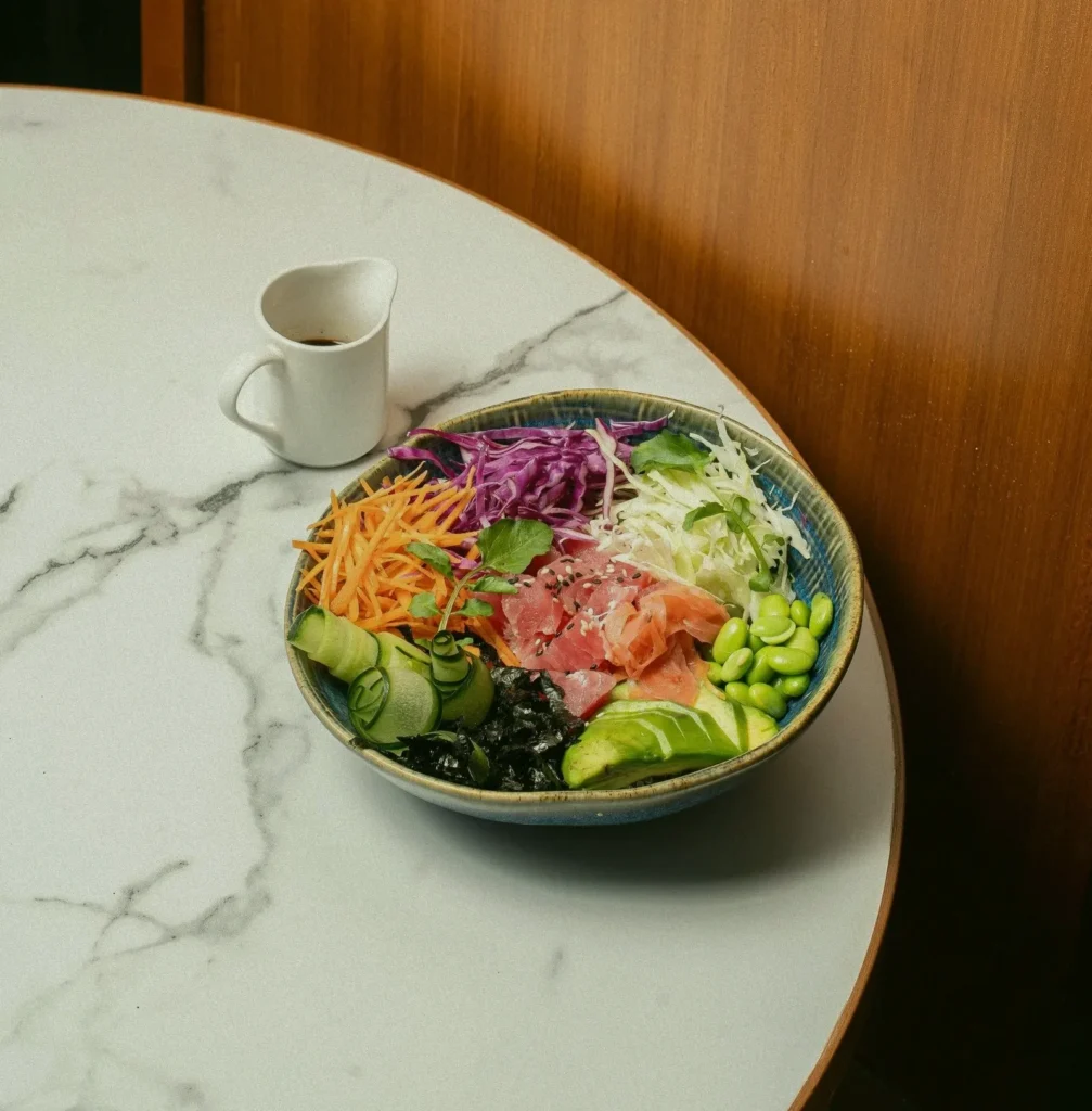 Fresh Poke Bowl with tuna, avocado, and vegetables at AT 06 Canggu Bali Title: Fresh and Healthy Poke Bowl at AT 06 Canggu