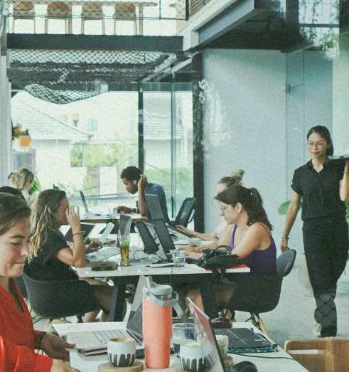 The Hidden Truth About Coworking Prices in Canggu: Why Smart Nomads Choose AT 06 2 Modern AT06 coworking space in Canggu with collaborative work areas, natural lighting, and professionals working at shared desks