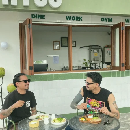 Two people enjoying breakfast at AT 06 Canggu Bali outdoor dining area